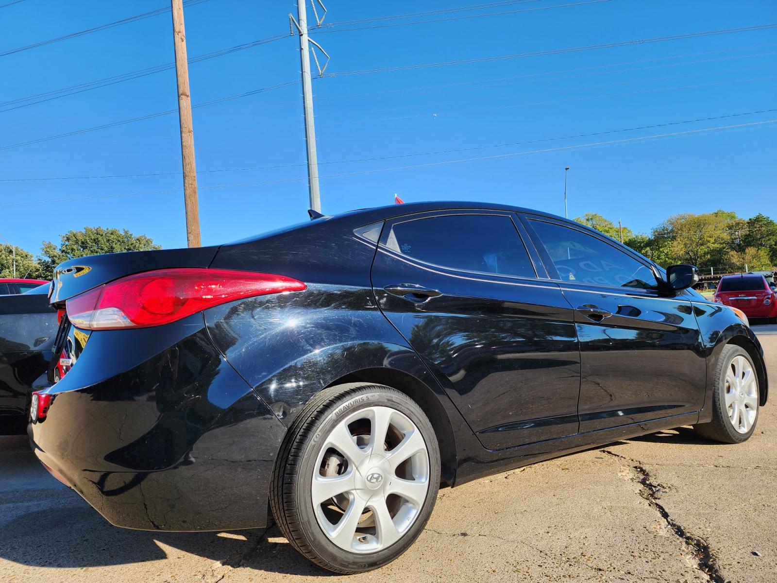 2013 BLACK /BEIGE Hyundai Elantra LIMITED (KMHDH4AE6DU) with an 1.8L L4 DOHC 16V engine, 6-Speed Automatic transmission, located at 2660 S.Garland Avenue, Garland, TX, 75041, (469) 298-3118, 32.885551, -96.655602 - Welcome to DallasAutos4Less, one of the Premier BUY HERE PAY HERE Dealers in the North Dallas Area. We specialize in financing to people with NO CREDIT or BAD CREDIT. We need proof of income, proof of residence, and a ID. Come buy your new car from us today!!rnrnThis is a very clean 2013 HYUNDAI ELA - Photo #4