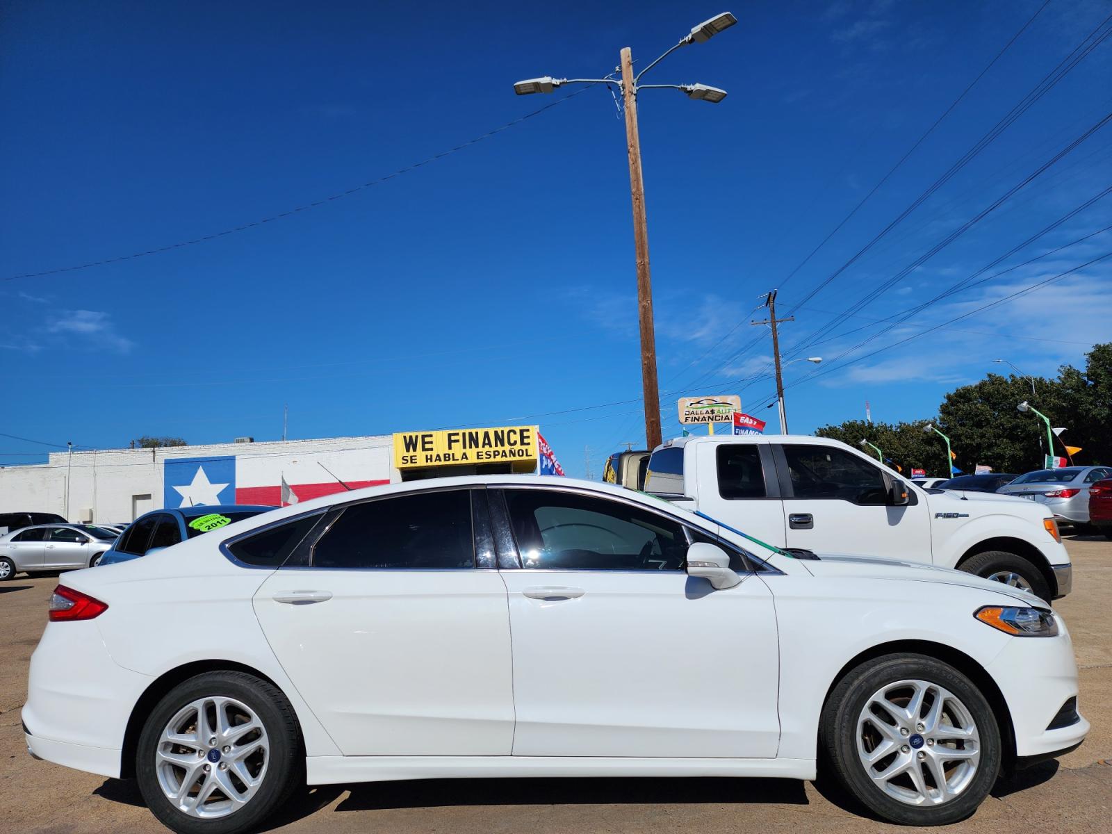 2014 WHITE Ford Fusion SE (3FA6P0HD5ER) with an 1.5L L4 DOHC 16V engine, AUTO transmission, located at 2660 S.Garland Avenue, Garland, TX, 75041, (469) 298-3118, 32.885551, -96.655602 - Welcome to DallasAutos4Less, one of the Premier BUY HERE PAY HERE Dealers in the North Dallas Area. We specialize in financing to people with NO CREDIT or BAD CREDIT. We need proof of income, proof of residence, and a ID. Come buy your new car from us today!!rnrnThis is a Super Clean 2014 FORD FUSIO - Photo #2