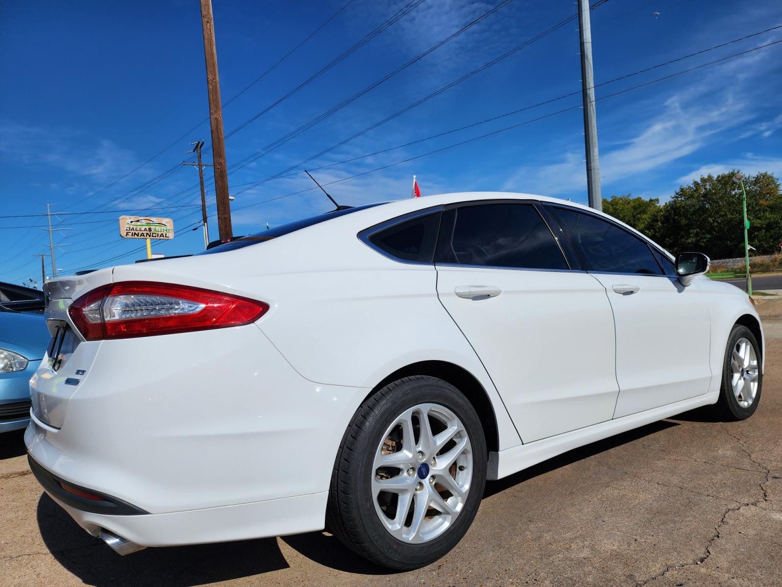 2014 WHITE Ford Fusion SE (3FA6P0HD5ER) with an 1.5L L4 DOHC 16V engine, AUTO transmission, located at 2660 S.Garland Avenue, Garland, TX, 75041, (469) 298-3118, 32.885551, -96.655602 - Welcome to DallasAutos4Less, one of the Premier BUY HERE PAY HERE Dealers in the North Dallas Area. We specialize in financing to people with NO CREDIT or BAD CREDIT. We need proof of income, proof of residence, and a ID. Come buy your new car from us today!!rnrnThis is a Super Clean 2014 FORD FUSIO - Photo #3