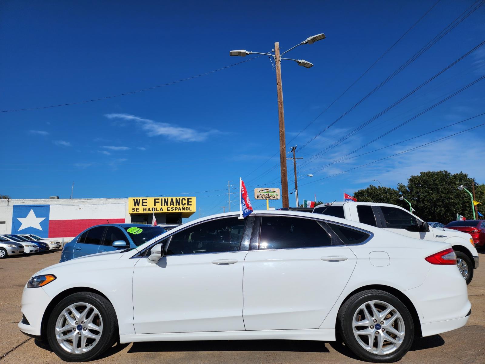 2014 WHITE Ford Fusion SE (3FA6P0HD5ER) with an 1.5L L4 DOHC 16V engine, AUTO transmission, located at 2660 S.Garland Avenue, Garland, TX, 75041, (469) 298-3118, 32.885551, -96.655602 - Welcome to DallasAutos4Less, one of the Premier BUY HERE PAY HERE Dealers in the North Dallas Area. We specialize in financing to people with NO CREDIT or BAD CREDIT. We need proof of income, proof of residence, and a ID. Come buy your new car from us today!!rnrnThis is a Super Clean 2014 FORD FUSIO - Photo #6