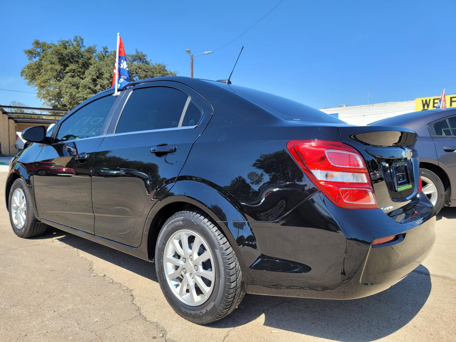 2017 BLACK Chevrolet Sonic LT (1G1JD5SH6H4) with an 1.8L L4 DOHC 24V engine, AUTO transmission, located at 2660 S.Garland Avenue, Garland, TX, 75041, (469) 298-3118, 32.885551, -96.655602 - Welcome to DallasAutos4Less, one of the Premier BUY HERE PAY HERE Dealers in the North Dallas Area. We specialize in financing to people with NO CREDIT or BAD CREDIT. We need proof of income, proof of residence, and a ID. Come buy your new car from us today!!rnrnThis is a very well cared for 2017 CH - Photo #5