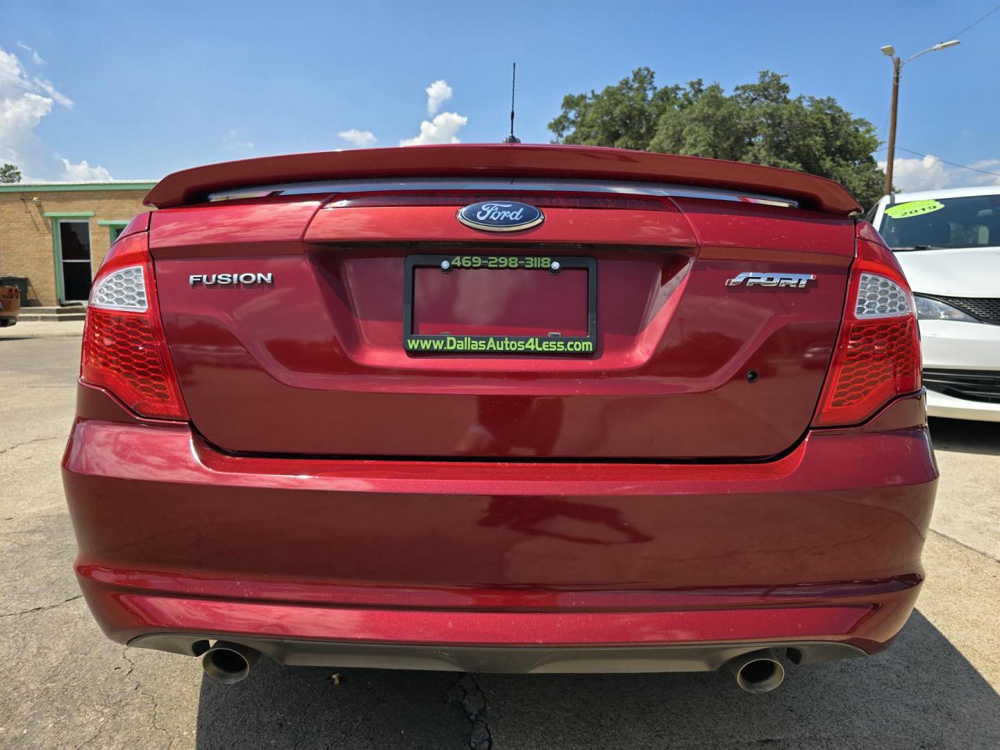 2010 RED Ford Fusion V6 Sport (3FAHP0KC4AR) with an 3.5L V6 DOHC 24V engine, AUTO transmission, located at 2660 S.Garland Avenue, Garland, TX, 75041, (469) 298-3118, 32.885551, -96.655602 - Photo#4