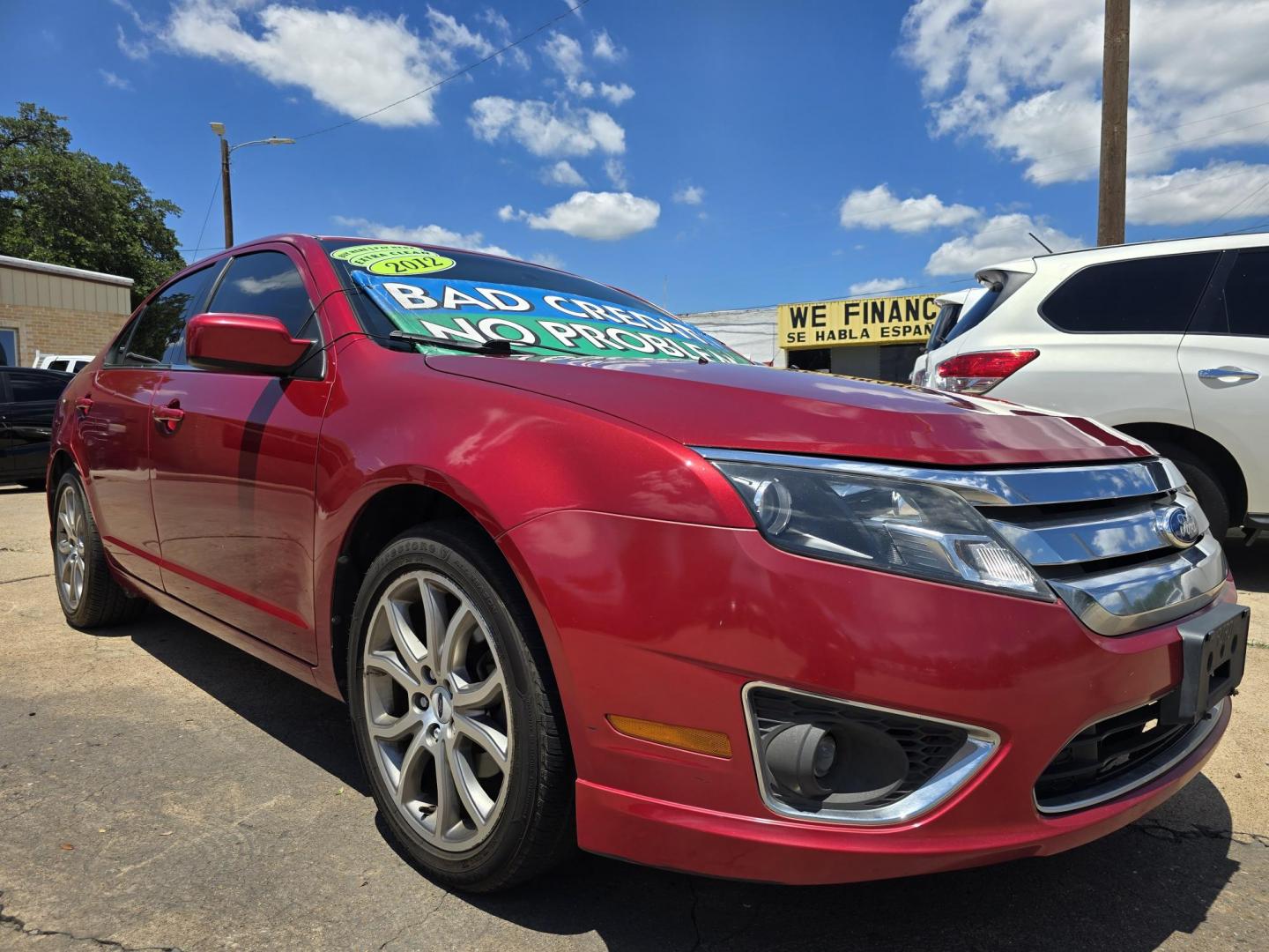 2012 RED Ford Fusion SE (3FAHP0HA8CR) with an 2.5L L4 DOHC 16V engine, AUTO transmission, located at 2660 S.Garland Avenue, Garland, TX, 75041, (469) 298-3118, 32.885551, -96.655602 - Photo#1