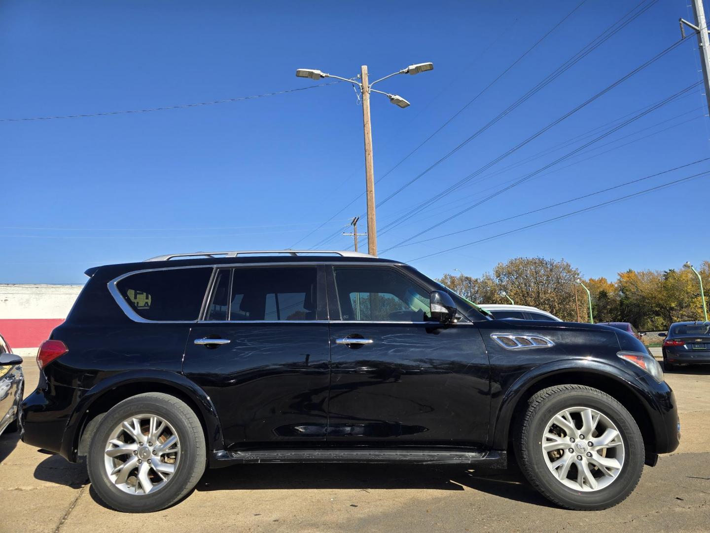 2012 BLACK Infiniti QX56 4WD (JN8AZ2NE7C9) with an 5.6L V8 DOHC 32V engine, 5-Speed Automatic transmission, located at 2660 S.Garland Avenue, Garland, TX, 75041, (469) 298-3118, 32.885551, -96.655602 - Photo#2