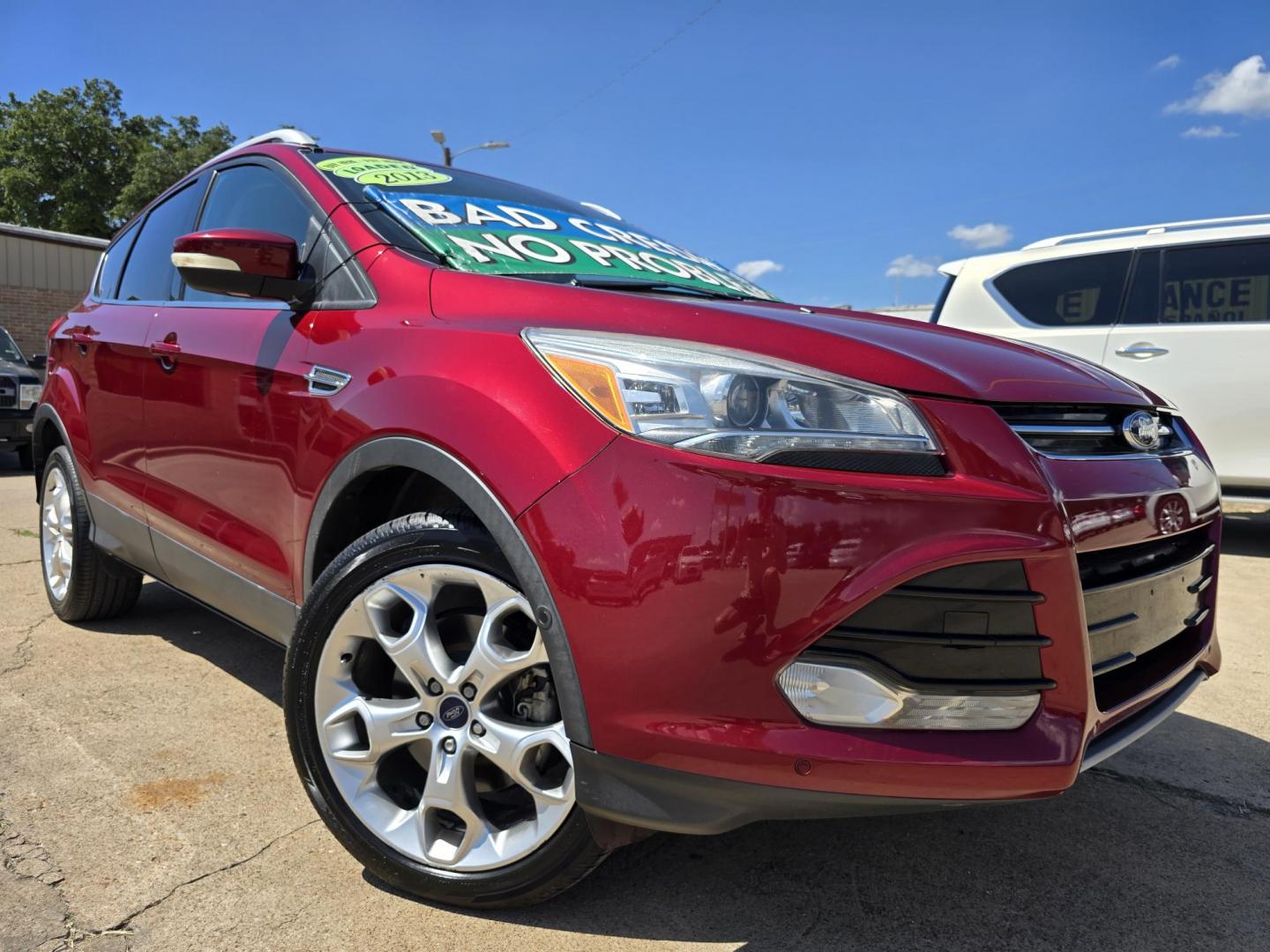 2013 RED Ford Escape Titanium (1FMCU0J93DU) with an 2.0L L4 DOHC 16V engine, 6-Speed Automatic transmission, located at 2660 S.Garland Avenue, Garland, TX, 75041, (469) 298-3118, 32.885551, -96.655602 - Welcome to DallasAutos4Less, one of the Premier BUY HERE PAY HERE Dealers in the North Dallas Area. We specialize in financing to people with NO CREDIT or BAD CREDIT. We need proof of income, proof of residence, and a ID. Come buy your new car from us today!! This is a Super Clean 2013 FORD ESCAP - Photo#0