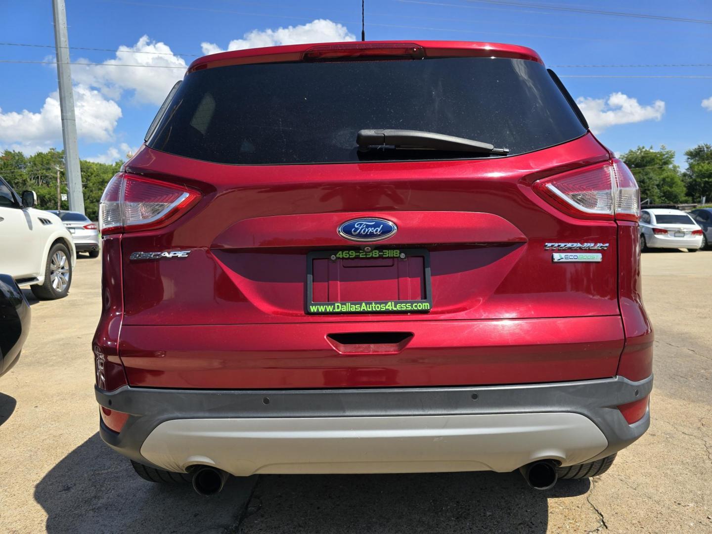 2013 RED Ford Escape Titanium (1FMCU0J93DU) with an 2.0L L4 DOHC 16V engine, 6-Speed Automatic transmission, located at 2660 S.Garland Avenue, Garland, TX, 75041, (469) 298-3118, 32.885551, -96.655602 - Welcome to DallasAutos4Less, one of the Premier BUY HERE PAY HERE Dealers in the North Dallas Area. We specialize in financing to people with NO CREDIT or BAD CREDIT. We need proof of income, proof of residence, and a ID. Come buy your new car from us today!! This is a Super Clean 2013 FORD ESCAP - Photo#4