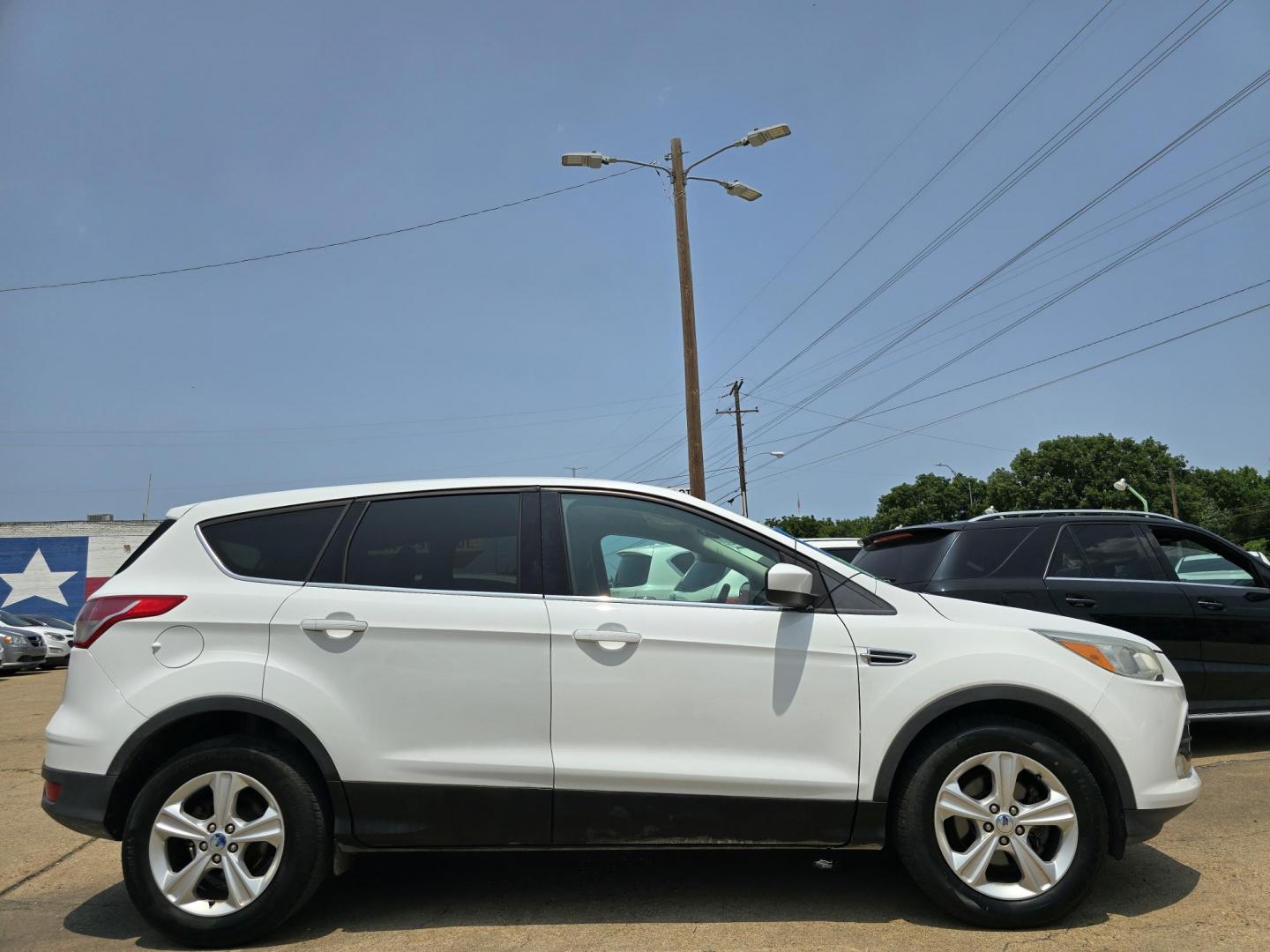 2013 Ford Escape SE (1FMCU0GX8DU) with an 1.6L L4 DOHC 16V engine, 6-Speed Automatic transmission, located at 2660 S.Garland Avenue, Garland, TX, 75041, (469) 298-3118, 32.885551, -96.655602 - Welcome to DallasAutos4Less, one of the Premier BUY HERE PAY HERE Dealers in the North Dallas Area. We specialize in financing to people with NO CREDIT or BAD CREDIT. We need proof of income, proof of residence, and a ID. Come buy your new car from us today!! This is a Super Clean 2013 FORD ESCAP - Photo#2