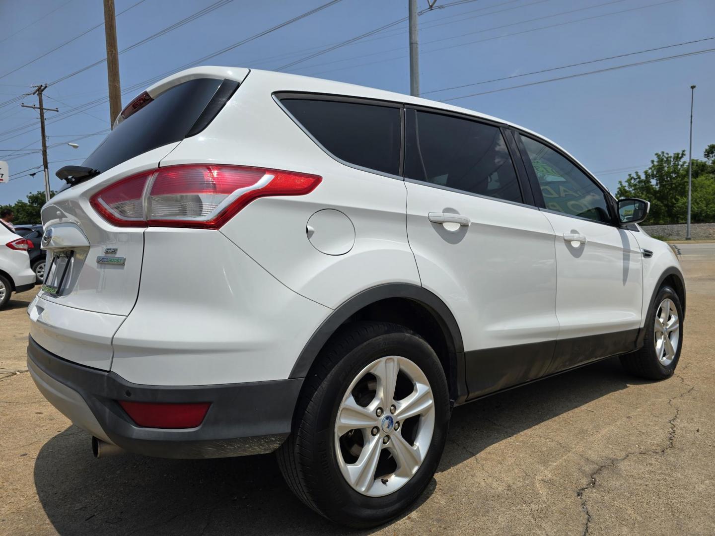 2013 Ford Escape SE (1FMCU0GX8DU) with an 1.6L L4 DOHC 16V engine, 6-Speed Automatic transmission, located at 2660 S.Garland Avenue, Garland, TX, 75041, (469) 298-3118, 32.885551, -96.655602 - Welcome to DallasAutos4Less, one of the Premier BUY HERE PAY HERE Dealers in the North Dallas Area. We specialize in financing to people with NO CREDIT or BAD CREDIT. We need proof of income, proof of residence, and a ID. Come buy your new car from us today!! This is a Super Clean 2013 FORD ESCAP - Photo#3