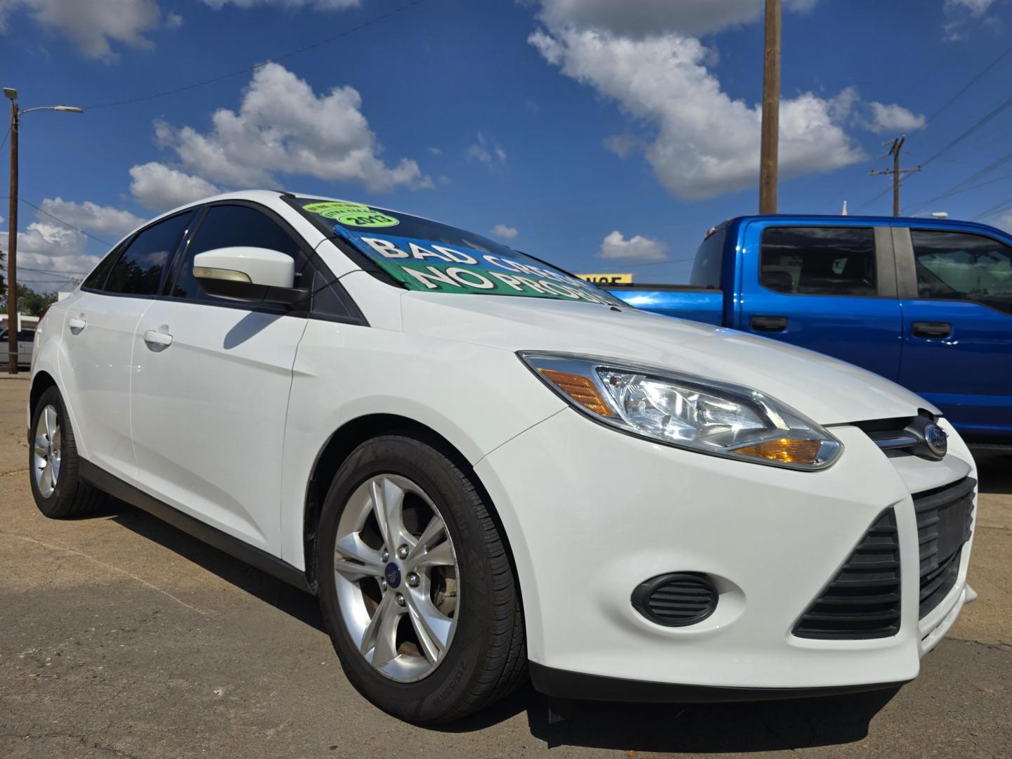 2013 WHITE Ford Focus SE (1FADP3F20DL) with an 2.0L L4 DOHC 16V engine, AUTO transmission, located at 2660 S.Garland Avenue, Garland, TX, 75041, (469) 298-3118, 32.885551, -96.655602 - Welcome to DallasAutos4Less, one of the Premier BUY HERE PAY HERE Dealers in the North Dallas Area. We specialize in financing to people with NO CREDIT or BAD CREDIT. We need proof of income, proof of residence, and a ID. Come buy your new car from us today!! This is a Super Clean 2013 FORD FOCUS - Photo#1