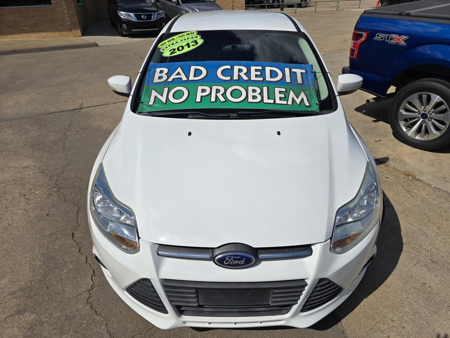 2013 WHITE Ford Focus SE (1FADP3F20DL) with an 2.0L L4 DOHC 16V engine, AUTO transmission, located at 2660 S.Garland Avenue, Garland, TX, 75041, (469) 298-3118, 32.885551, -96.655602 - Welcome to DallasAutos4Less, one of the Premier BUY HERE PAY HERE Dealers in the North Dallas Area. We specialize in financing to people with NO CREDIT or BAD CREDIT. We need proof of income, proof of residence, and a ID. Come buy your new car from us today!! This is a Super Clean 2013 FORD FOCUS - Photo#9