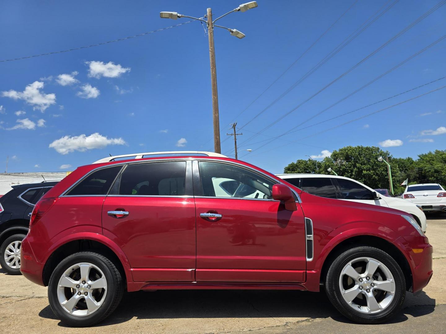 2014 RED /BLACK Chevrolet Captiva Sport LTZ (3GNAL4EK8ES) with an 2.4L L4 DOHC 16V FFV engine, 6-Speed Automatic transmission, located at 2660 S.Garland Avenue, Garland, TX, 75041, (469) 298-3118, 32.885551, -96.655602 - Welcome to DallasAutos4Less, one of the Premier BUY HERE PAY HERE Dealers in the North Dallas Area. We specialize in financing to people with NO CREDIT or BAD CREDIT. We need proof of income, proof of residence, and a ID. Come buy your new car from us today!! This is a Loaded 2014 CHEVY CAPTIVA L - Photo#2