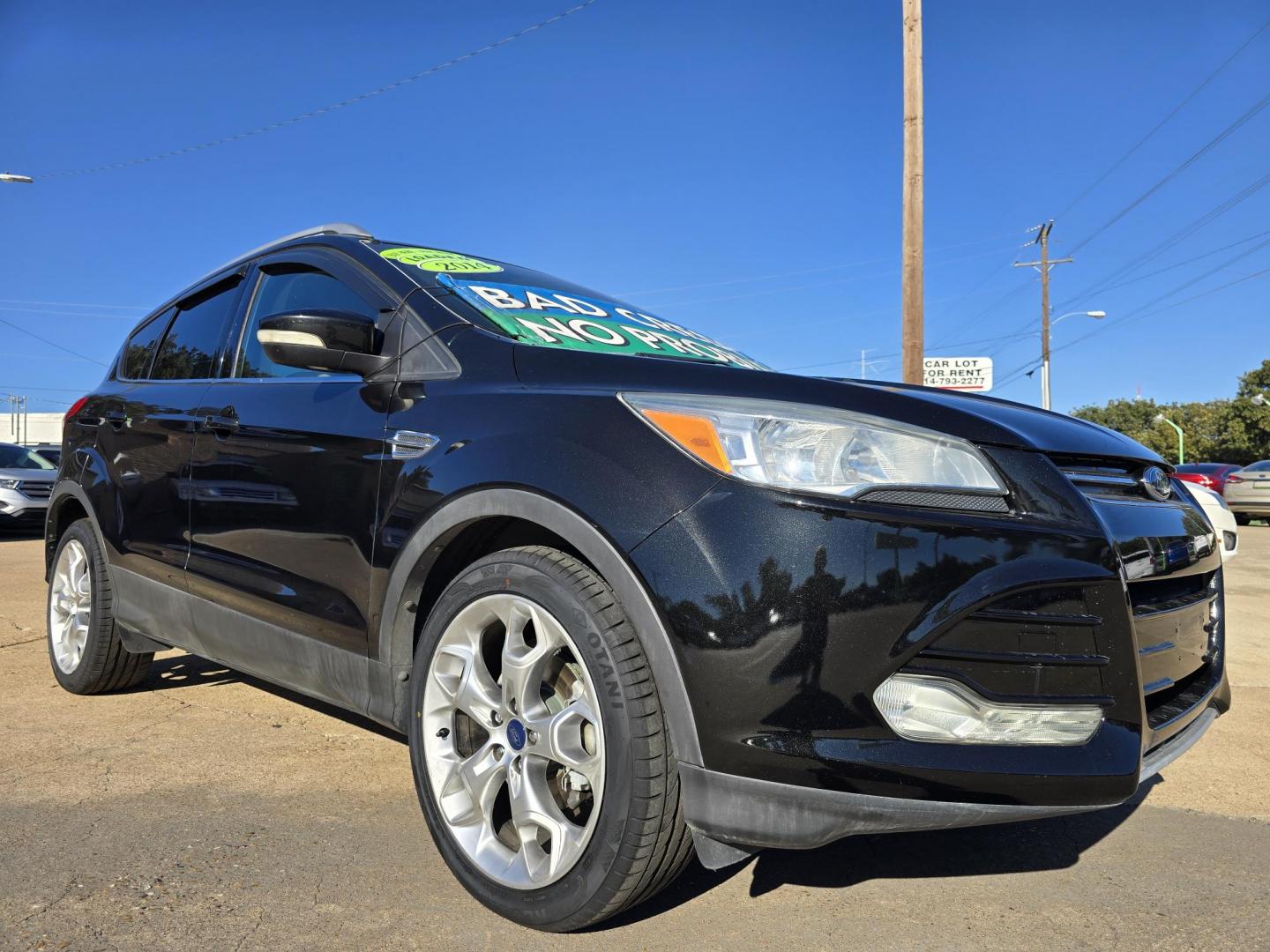 2014 BLACK Ford Escape Titanium (1FMCU0JX4EU) with an 1.6L L4 DOHC 16V engine, 6-Speed Automatic transmission, located at 2660 S.Garland Avenue, Garland, TX, 75041, (469) 298-3118, 32.885551, -96.655602 - Welcome to DallasAutos4Less, one of the Premier BUY HERE PAY HERE Dealers in the North Dallas Area. We specialize in financing to people with NO CREDIT or BAD CREDIT. We need proof of income, proof of residence, and a ID. Come buy your new car from us today!! This is a Super Clean 2014 FORD ESCAP - Photo#1