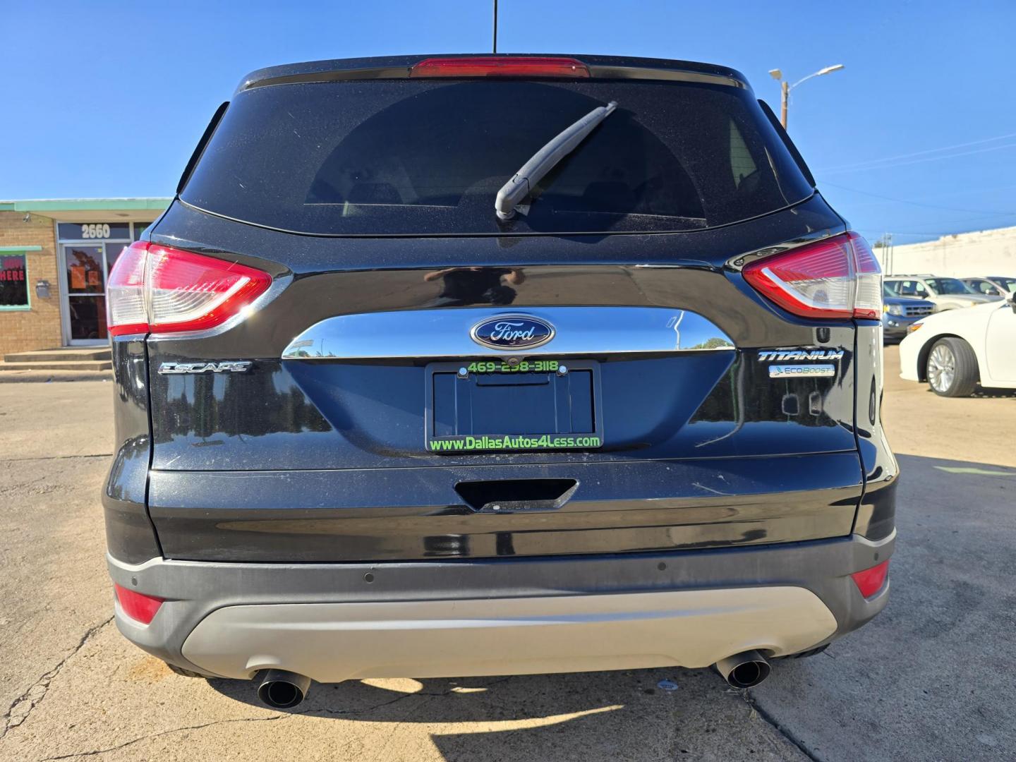 2014 BLACK Ford Escape Titanium (1FMCU0JX4EU) with an 1.6L L4 DOHC 16V engine, 6-Speed Automatic transmission, located at 2660 S.Garland Avenue, Garland, TX, 75041, (469) 298-3118, 32.885551, -96.655602 - Welcome to DallasAutos4Less, one of the Premier BUY HERE PAY HERE Dealers in the North Dallas Area. We specialize in financing to people with NO CREDIT or BAD CREDIT. We need proof of income, proof of residence, and a ID. Come buy your new car from us today!! This is a Super Clean 2014 FORD ESCAP - Photo#4
