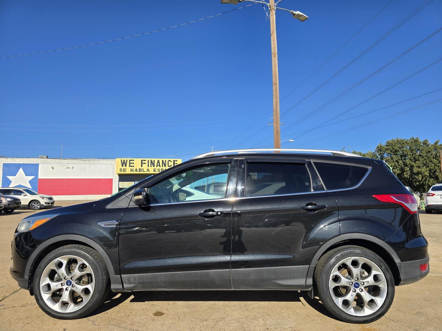 2014 BLACK Ford Escape Titanium (1FMCU0JX4EU) with an 1.6L L4 DOHC 16V engine, 6-Speed Automatic transmission, located at 2660 S.Garland Avenue, Garland, TX, 75041, (469) 298-3118, 32.885551, -96.655602 - Welcome to DallasAutos4Less, one of the Premier BUY HERE PAY HERE Dealers in the North Dallas Area. We specialize in financing to people with NO CREDIT or BAD CREDIT. We need proof of income, proof of residence, and a ID. Come buy your new car from us today!! This is a Super Clean 2014 FORD ESCAP - Photo#6