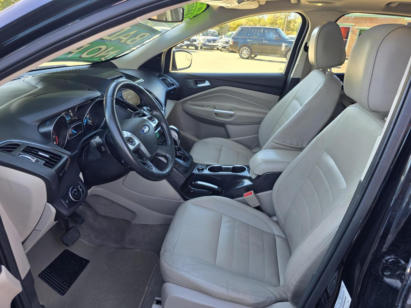 2014 BLACK Ford Escape Titanium (1FMCU0JX4EU) with an 1.6L L4 DOHC 16V engine, 6-Speed Automatic transmission, located at 2660 S.Garland Avenue, Garland, TX, 75041, (469) 298-3118, 32.885551, -96.655602 - Welcome to DallasAutos4Less, one of the Premier BUY HERE PAY HERE Dealers in the North Dallas Area. We specialize in financing to people with NO CREDIT or BAD CREDIT. We need proof of income, proof of residence, and a ID. Come buy your new car from us today!! This is a Super Clean 2014 FORD ESCAP - Photo#11