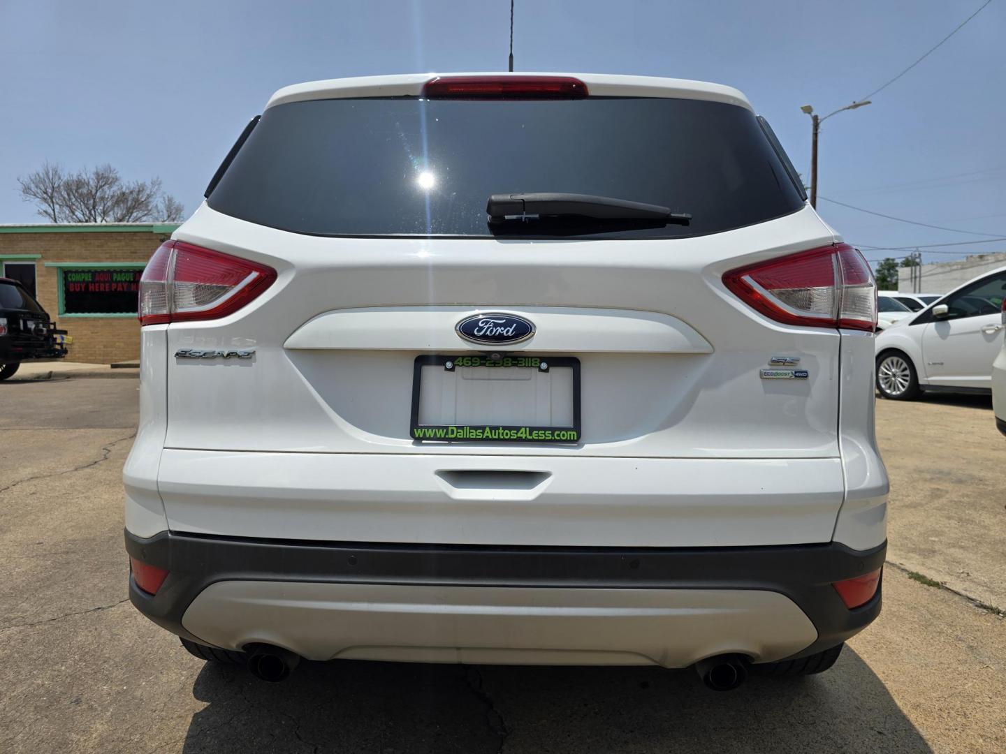2016 WHITE Ford Escape SE (1FMCU9GX2GU) with an 1.6L L4 DOHC 16V engine, 6-Speed Automatic transmission, located at 2660 S.Garland Avenue, Garland, TX, 75041, (469) 298-3118, 32.885551, -96.655602 - Welcome to DallasAutos4Less, one of the Premier BUY HERE PAY HERE Dealers in the North Dallas Area. We specialize in financing to people with NO CREDIT or BAD CREDIT. We need proof of income, proof of residence, and a ID. Come buy your new car from us today!! This is a Super Clean 2016 FORD ESCAP - Photo#4