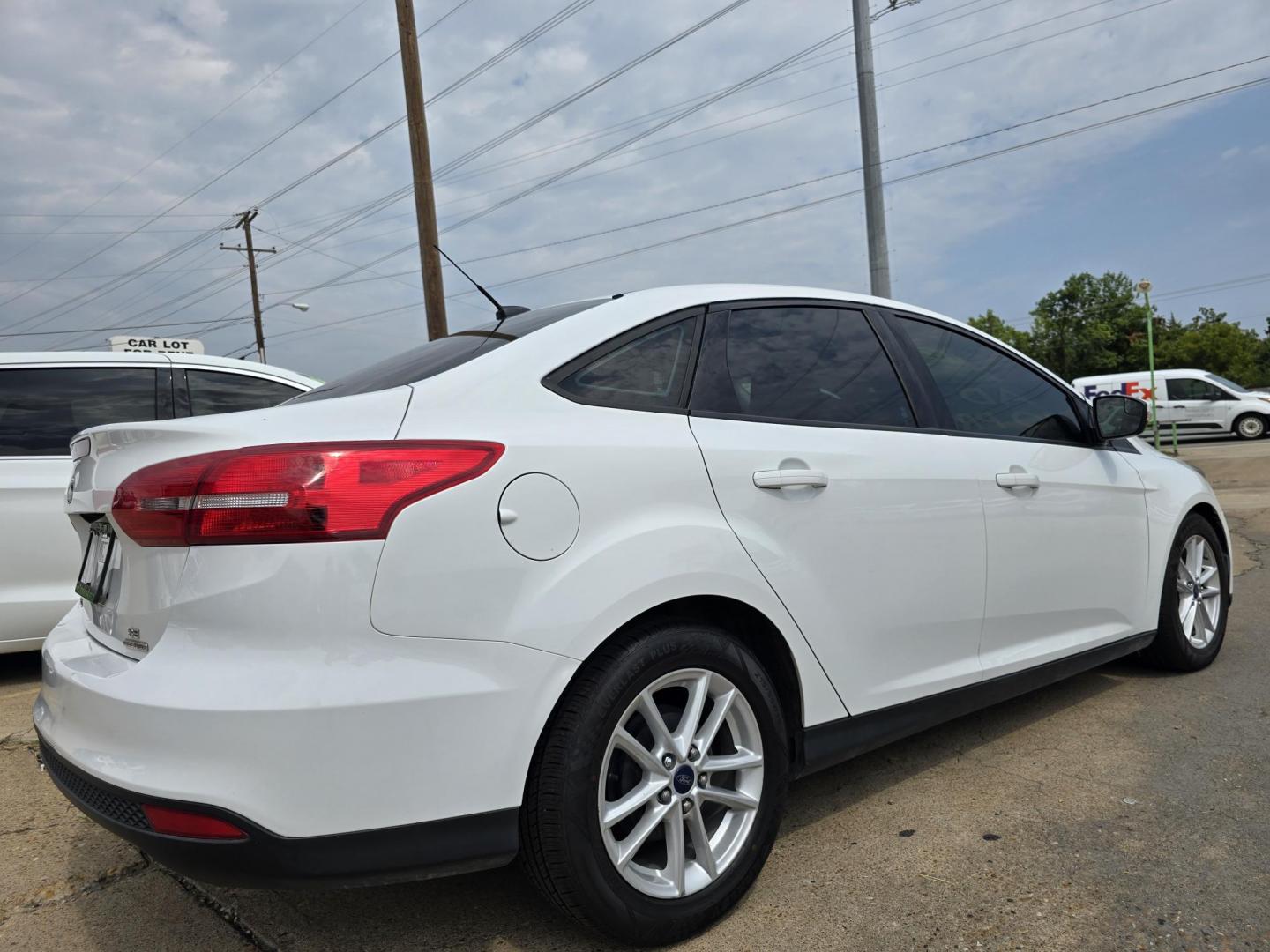 2016 WHITE Ford Focus SE (1FADP3F24GL) with an 2.0L L4 DOHC 16V engine, AUTO transmission, located at 2660 S.Garland Avenue, Garland, TX, 75041, (469) 298-3118, 32.885551, -96.655602 - Welcome to DallasAutos4Less, one of the Premier BUY HERE PAY HERE Dealers in the North Dallas Area. We specialize in financing to people with NO CREDIT or BAD CREDIT. We need proof of income, proof of residence, and a ID. Come buy your new car from us today!! This is a Super Clean 2016 FORD FOCUS - Photo#3