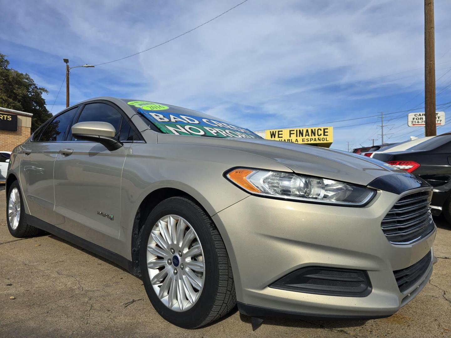 2016 GOLD Ford Fusion Hybrid S (3FA6P0UU2GR) with an 2.0L L4 DOHC 16V HYBRID engine, CVT transmission, located at 2660 S.Garland Avenue, Garland, TX, 75041, (469) 298-3118, 32.885551, -96.655602 - Photo#1