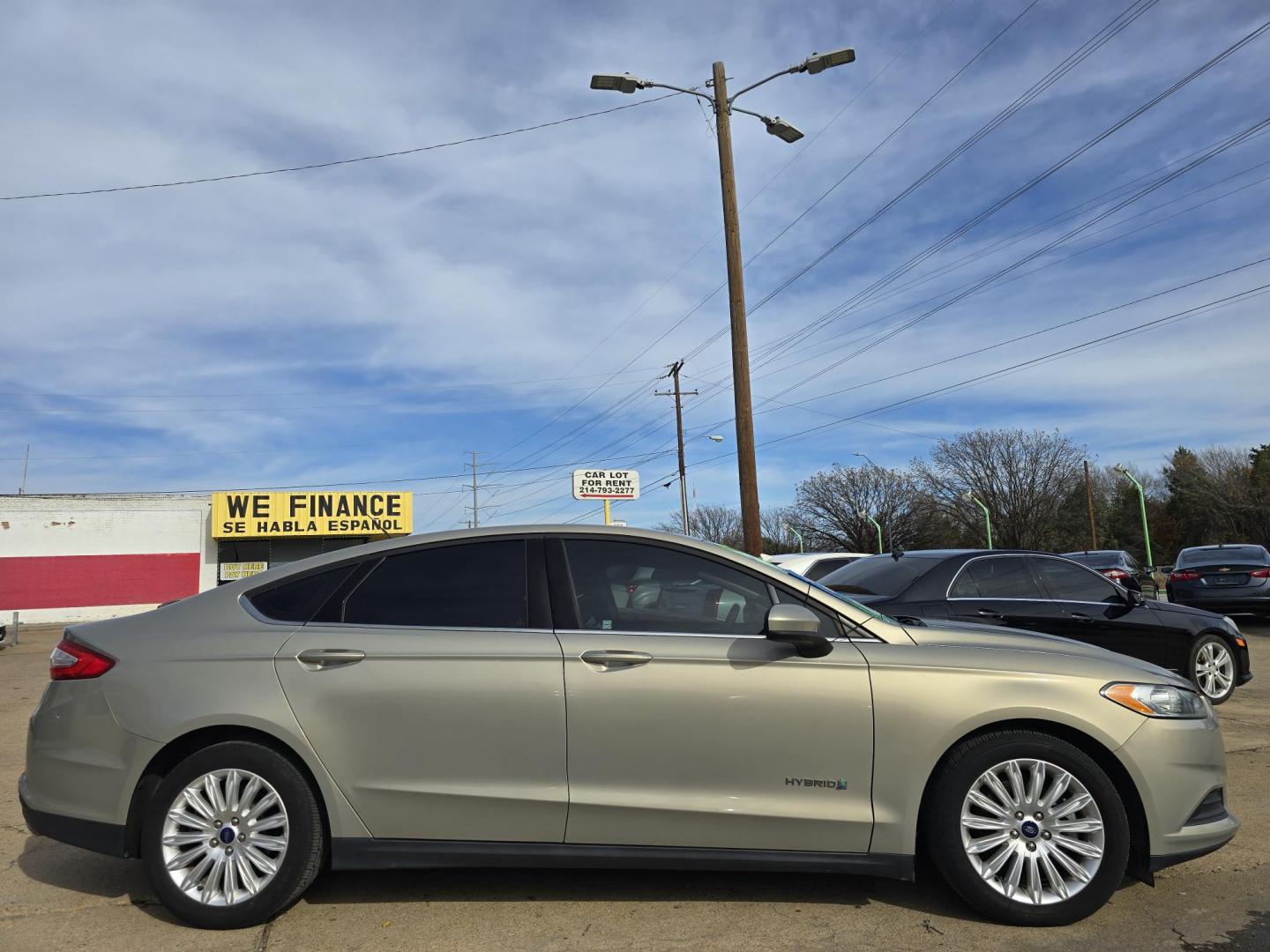 2016 GOLD Ford Fusion Hybrid S (3FA6P0UU2GR) with an 2.0L L4 DOHC 16V HYBRID engine, CVT transmission, located at 2660 S.Garland Avenue, Garland, TX, 75041, (469) 298-3118, 32.885551, -96.655602 - Photo#2