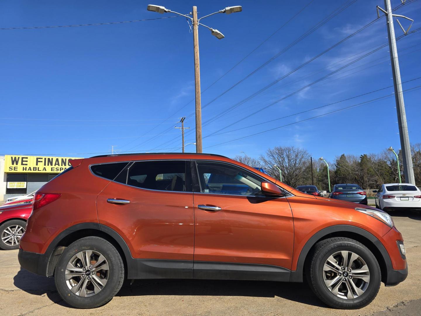 2016 ORANGE Hyundai Santa Fe Sport (5XYZU3LBXGG) with an 2.4L L4 DOHC 16V engine, 6-Speed Automatic transmission, located at 2660 S.Garland Avenue, Garland, TX, 75041, (469) 298-3118, 32.885551, -96.655602 - Photo#2