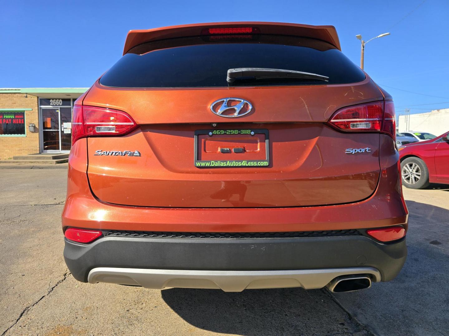 2016 ORANGE Hyundai Santa Fe Sport (5XYZU3LBXGG) with an 2.4L L4 DOHC 16V engine, 6-Speed Automatic transmission, located at 2660 S.Garland Avenue, Garland, TX, 75041, (469) 298-3118, 32.885551, -96.655602 - Photo#4