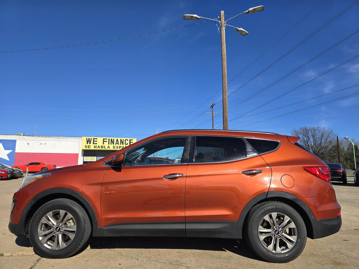 2016 ORANGE Hyundai Santa Fe Sport (5XYZU3LBXGG) with an 2.4L L4 DOHC 16V engine, 6-Speed Automatic transmission, located at 2660 S.Garland Avenue, Garland, TX, 75041, (469) 298-3118, 32.885551, -96.655602 - Photo#6