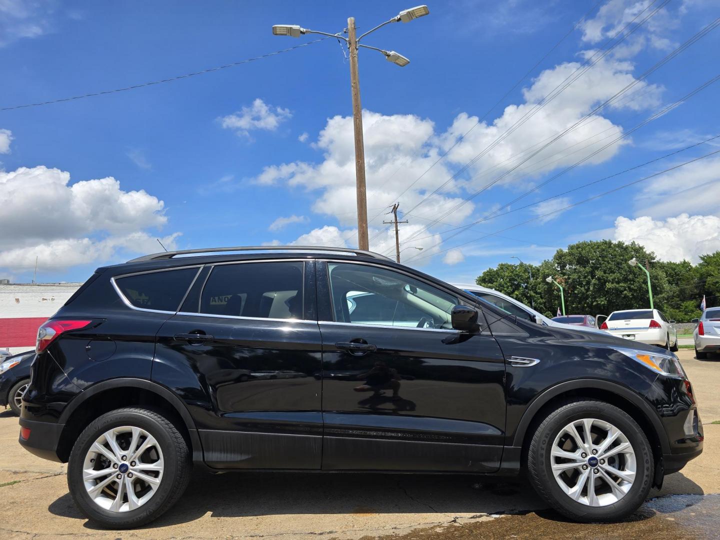 2018 BLACK Ford Escape SE (1FMCU0GD0JU) with an 1.5L L4 DOHC 16V engine, 6A transmission, located at 2660 S.Garland Avenue, Garland, TX, 75041, (469) 298-3118, 32.885551, -96.655602 - Photo#2