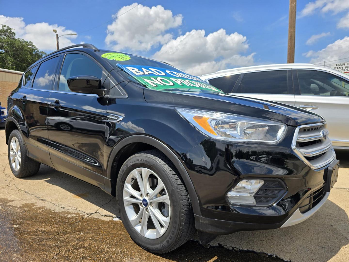 2018 BLACK Ford Escape SE (1FMCU0GD0JU) with an 1.5L L4 DOHC 16V engine, 6A transmission, located at 2660 S.Garland Avenue, Garland, TX, 75041, (469) 298-3118, 32.885551, -96.655602 - Photo#1